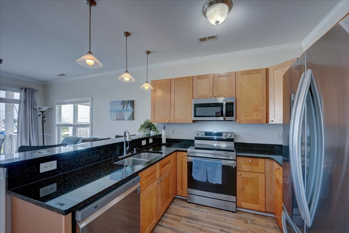 Kitchen showing maple cabinets, granite counters and stainless appliances